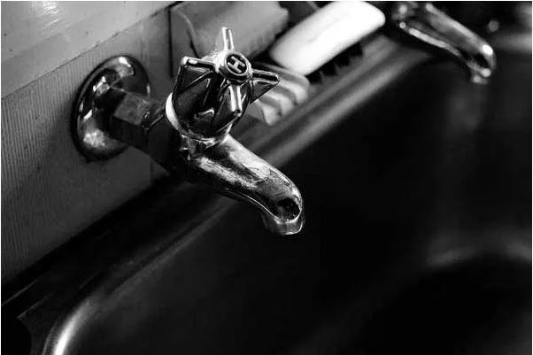 black and white photo of a sink